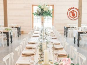 An elegant Kaleidoscope 502 Venue with table and tableware with white Classic X back chair and pink walls of background