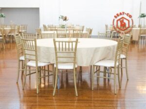 An evente from Pachanga Party Rental with one tables and some gold chiavari chairs